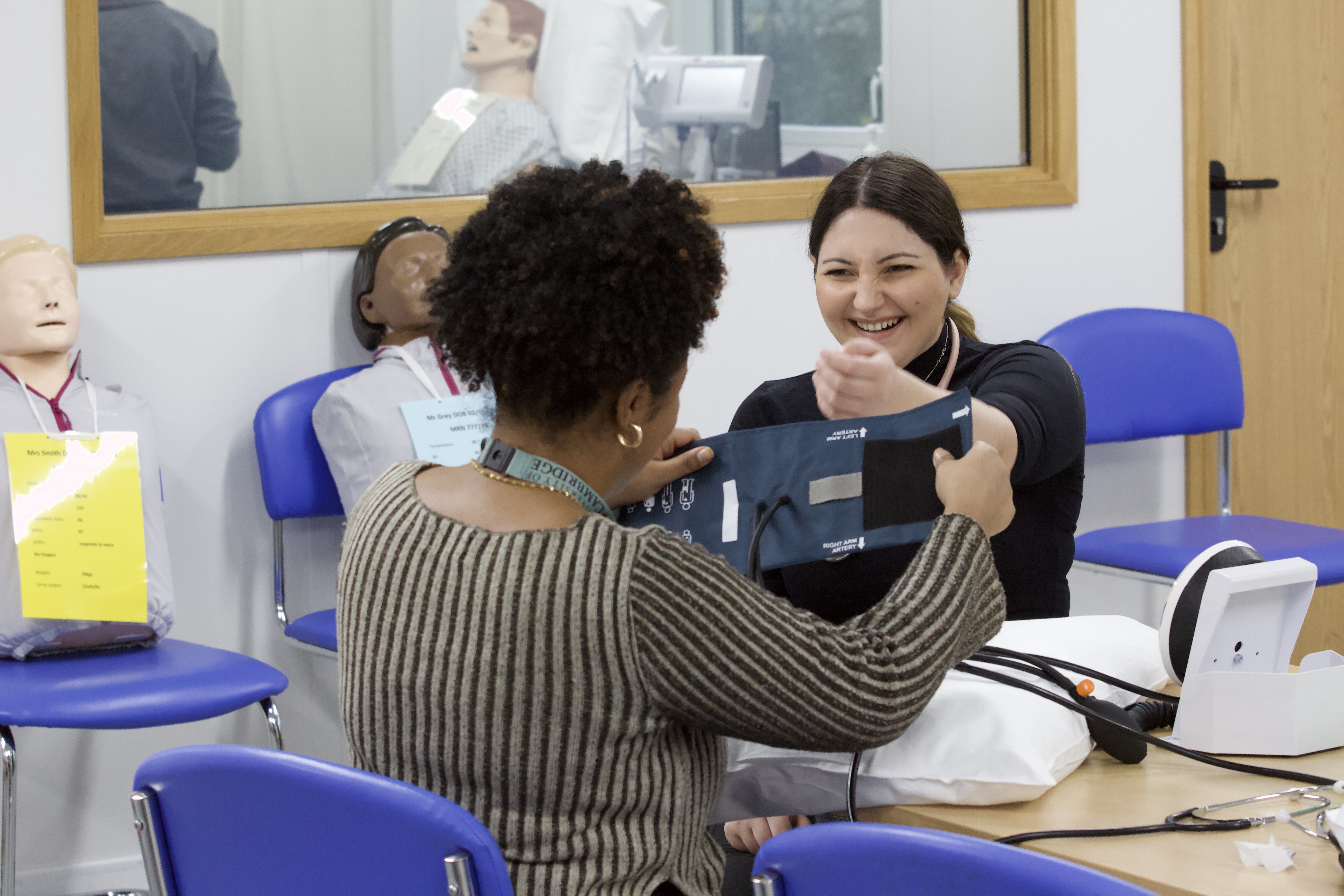 Two students learning in a room