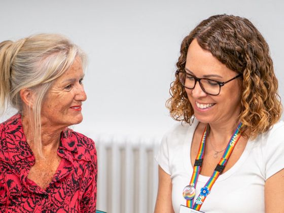 A patient and a member of staff talking together