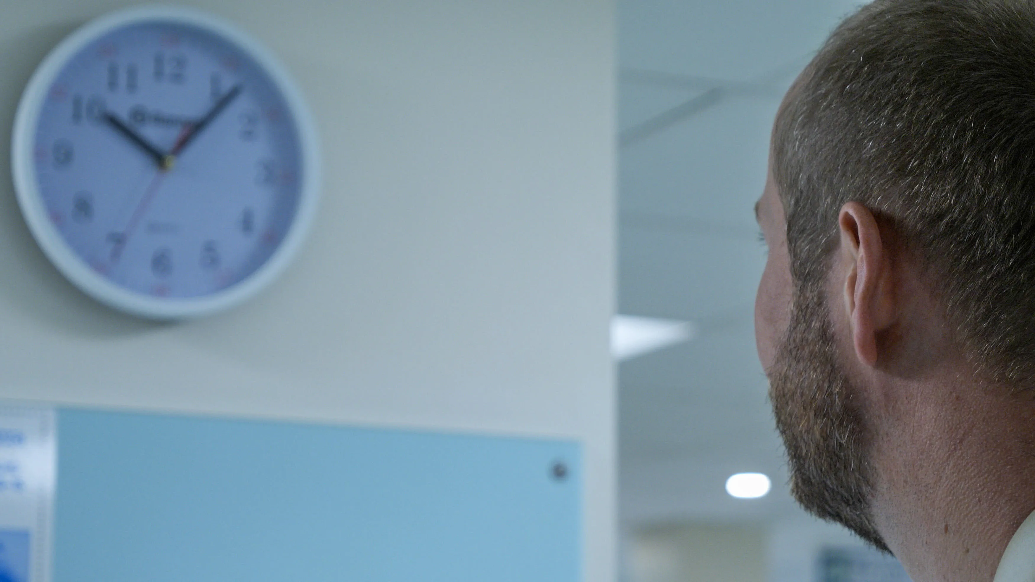 Ed Kirkham looking at clock
