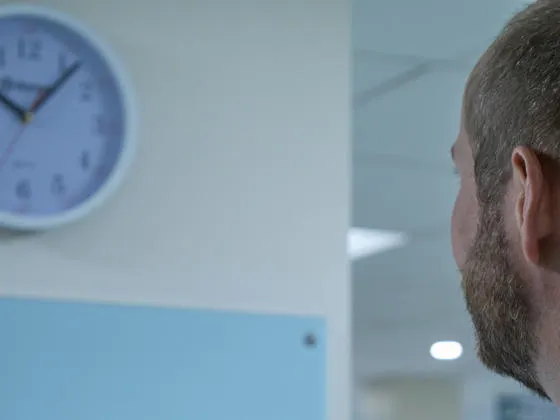 Ed Kirkham looking at clock