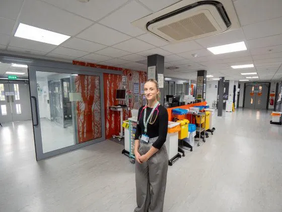 Student doctor stood on a ward