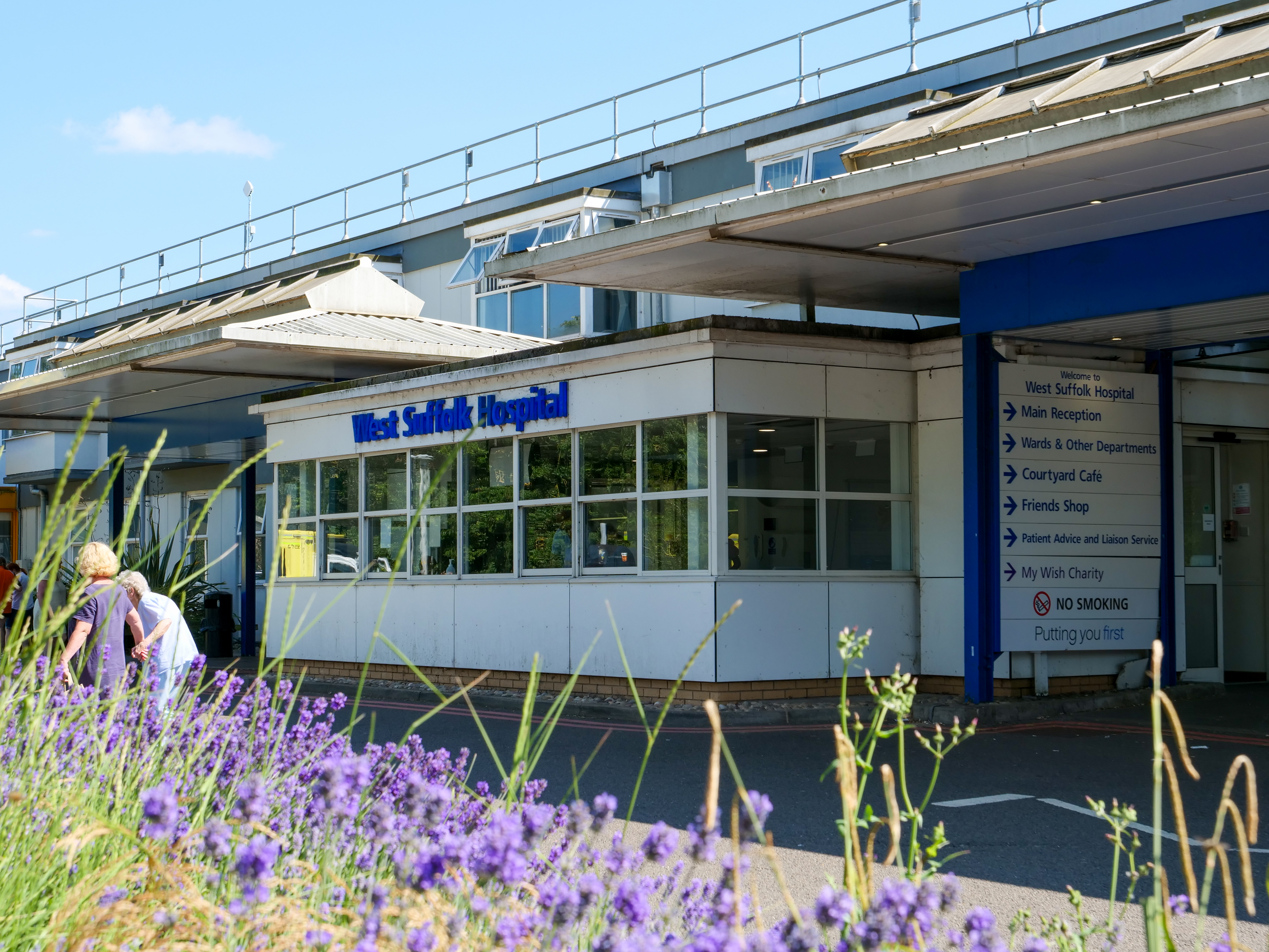 Exterior of West Suffolk Hospital with flowers