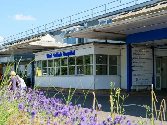 Exterior of West Suffolk Hospital with flowers