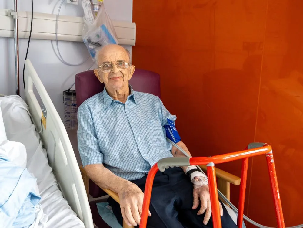 Mr Gill after surgery by his bedside