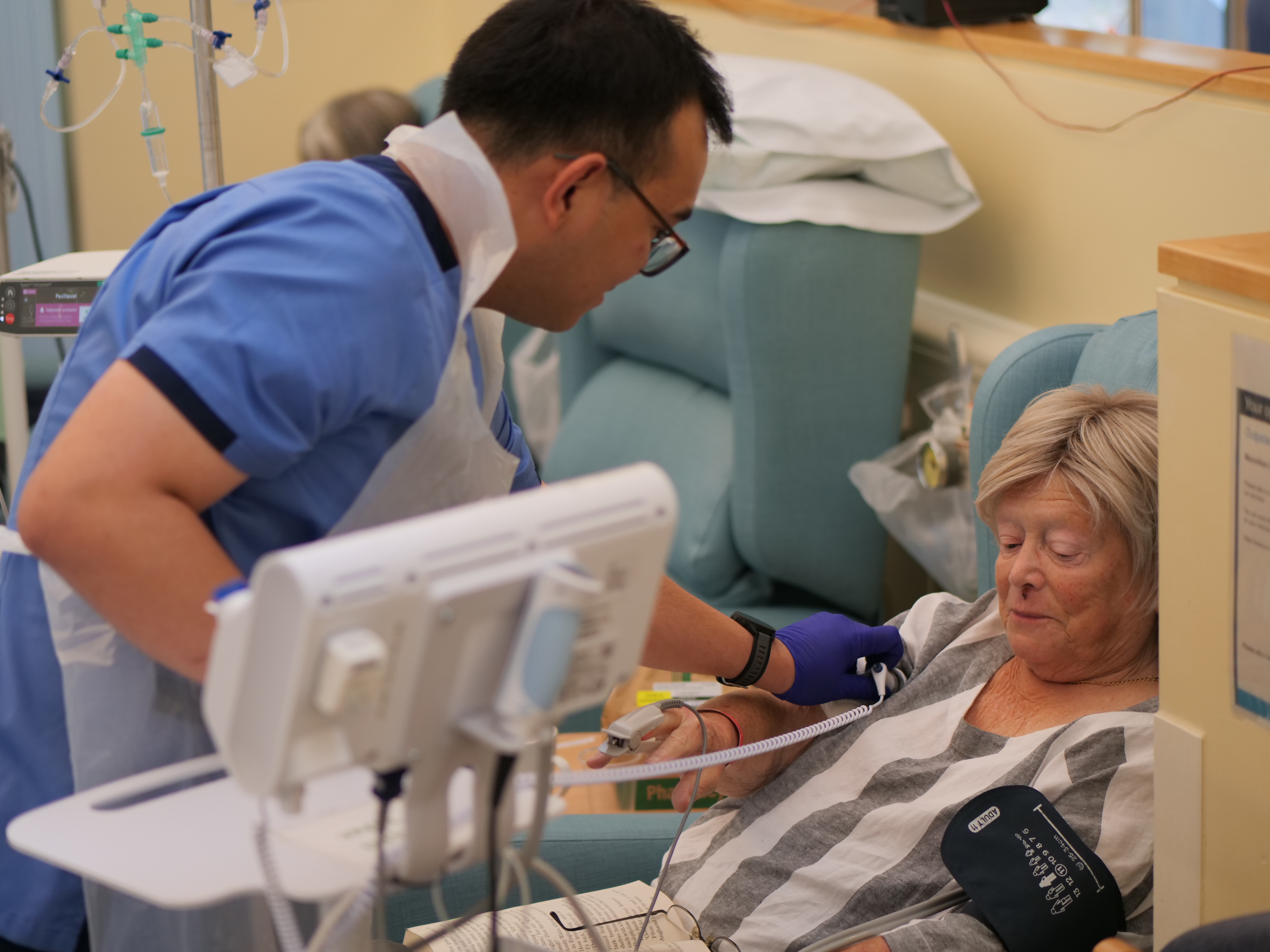 Nurse with patient in cancer day unit