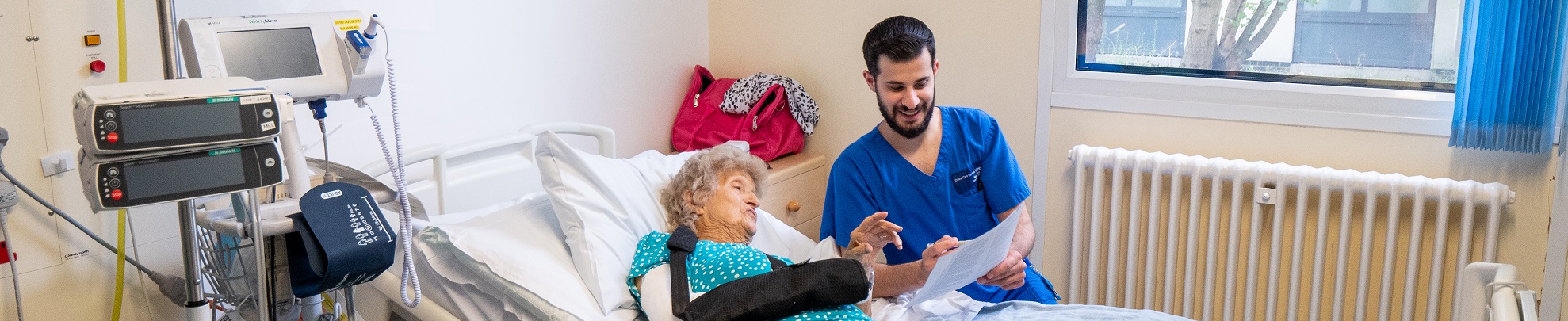 Nurse with patient on cancer ward