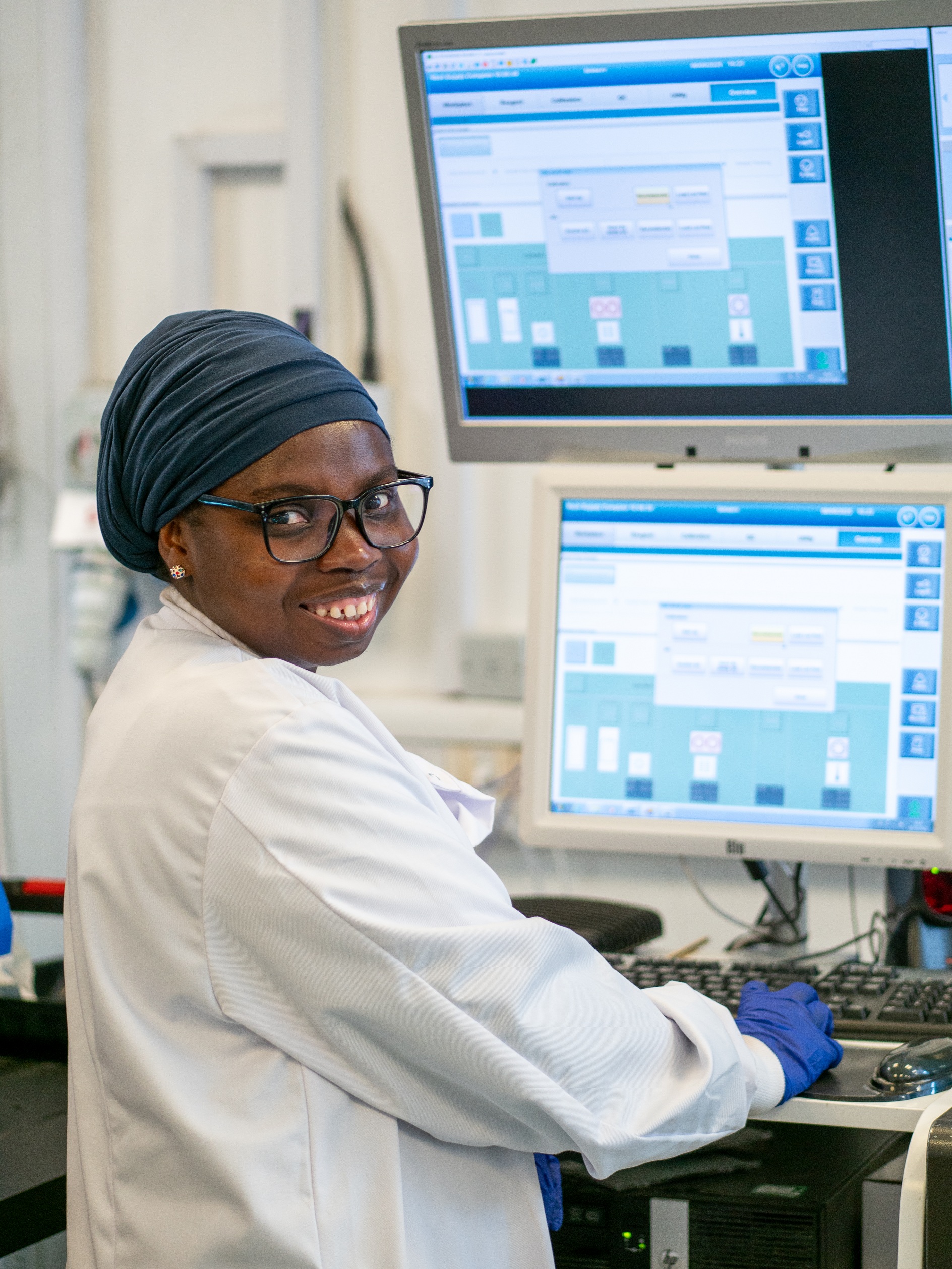 Pathology colleague looking to the camera and smiling