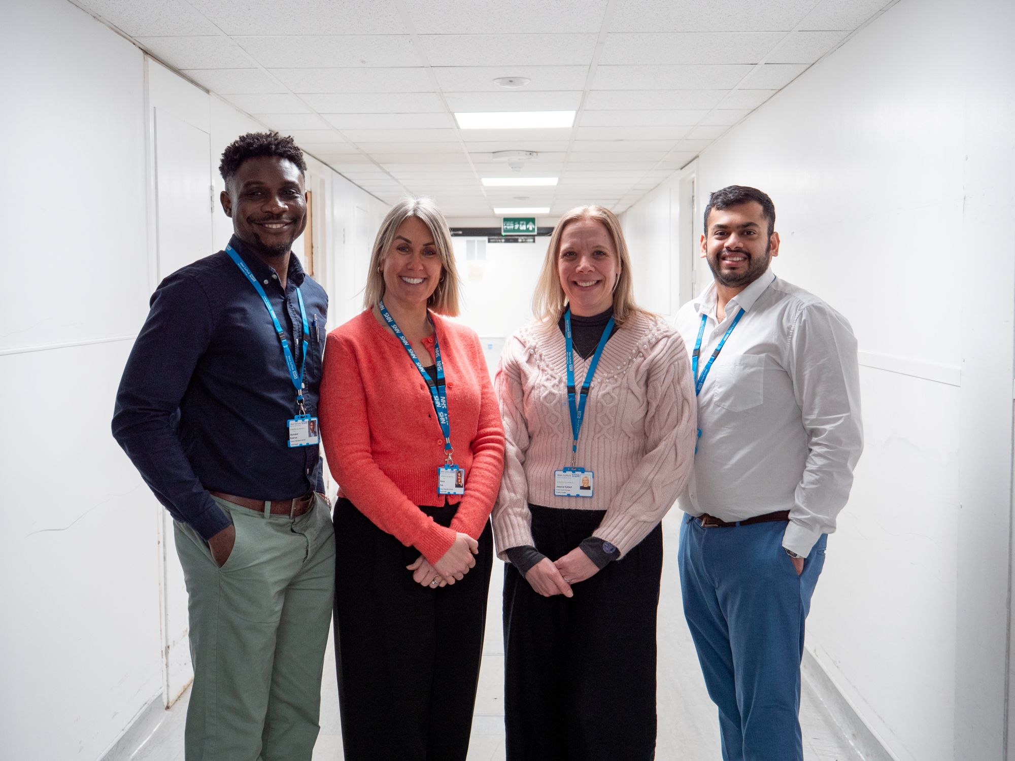 The four members of the smoke free team in a corridor