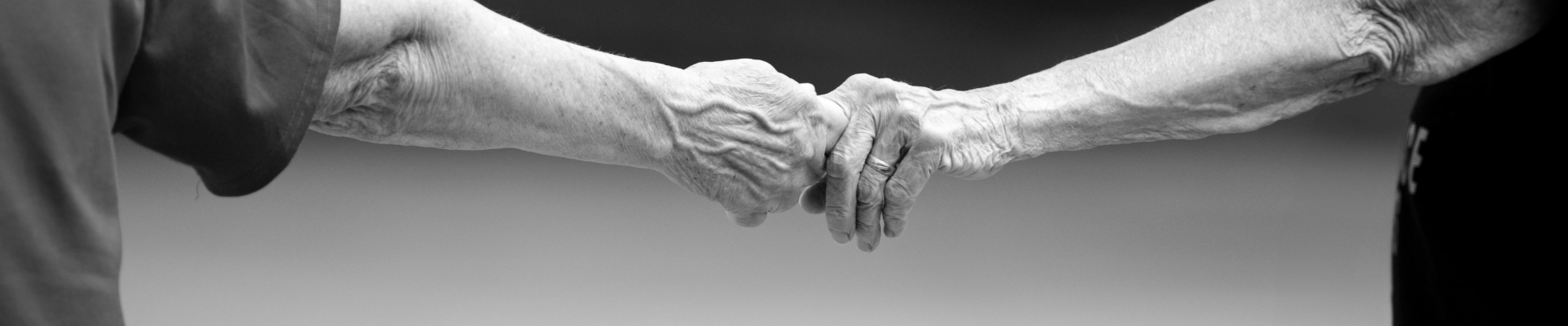 Two people touching hands