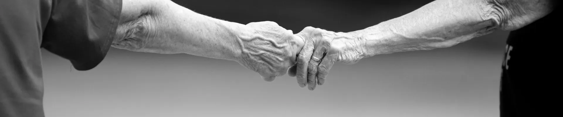 Two people touching hands