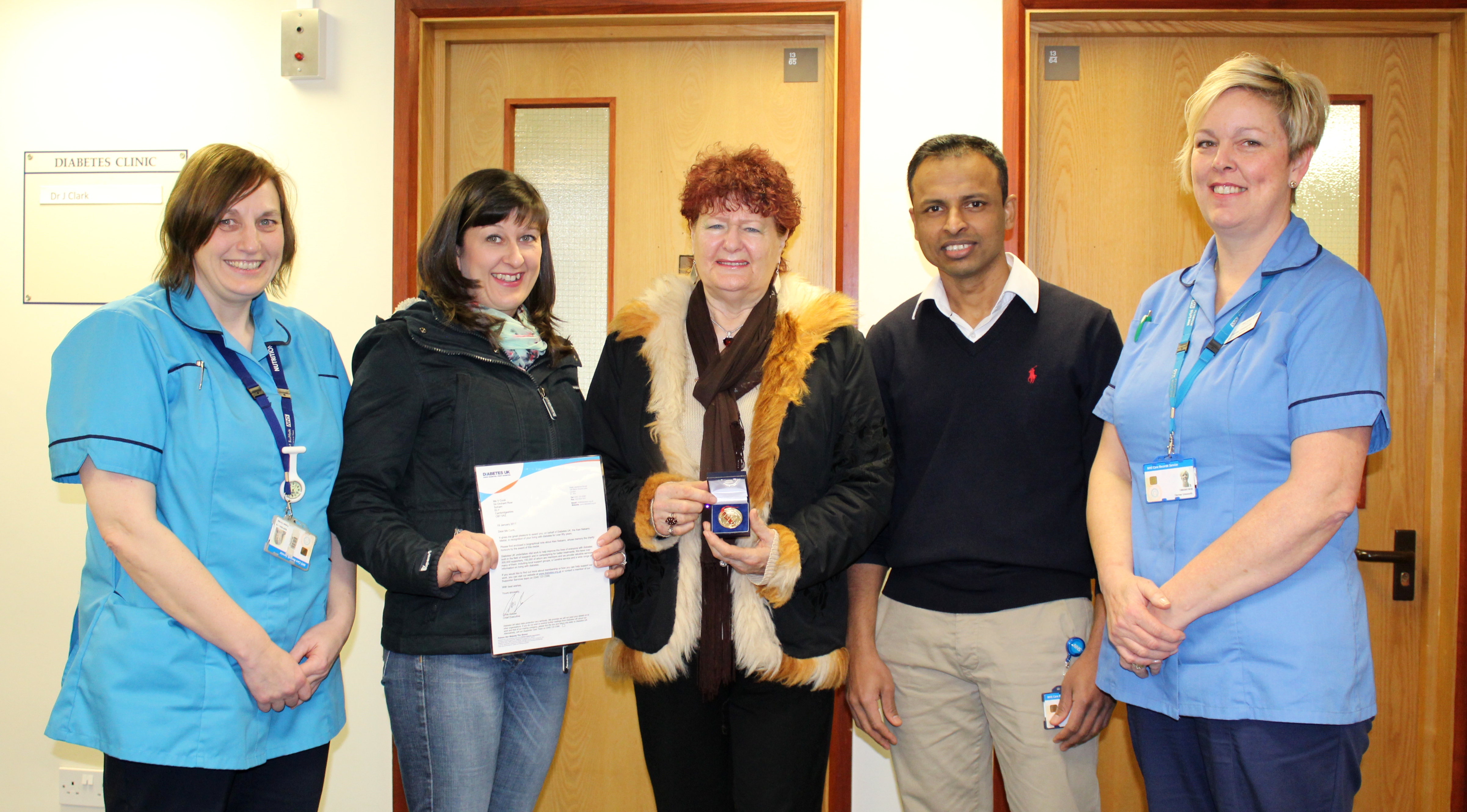 Valeria Cook, centre, with her daughter and staff from the diabetes unit.