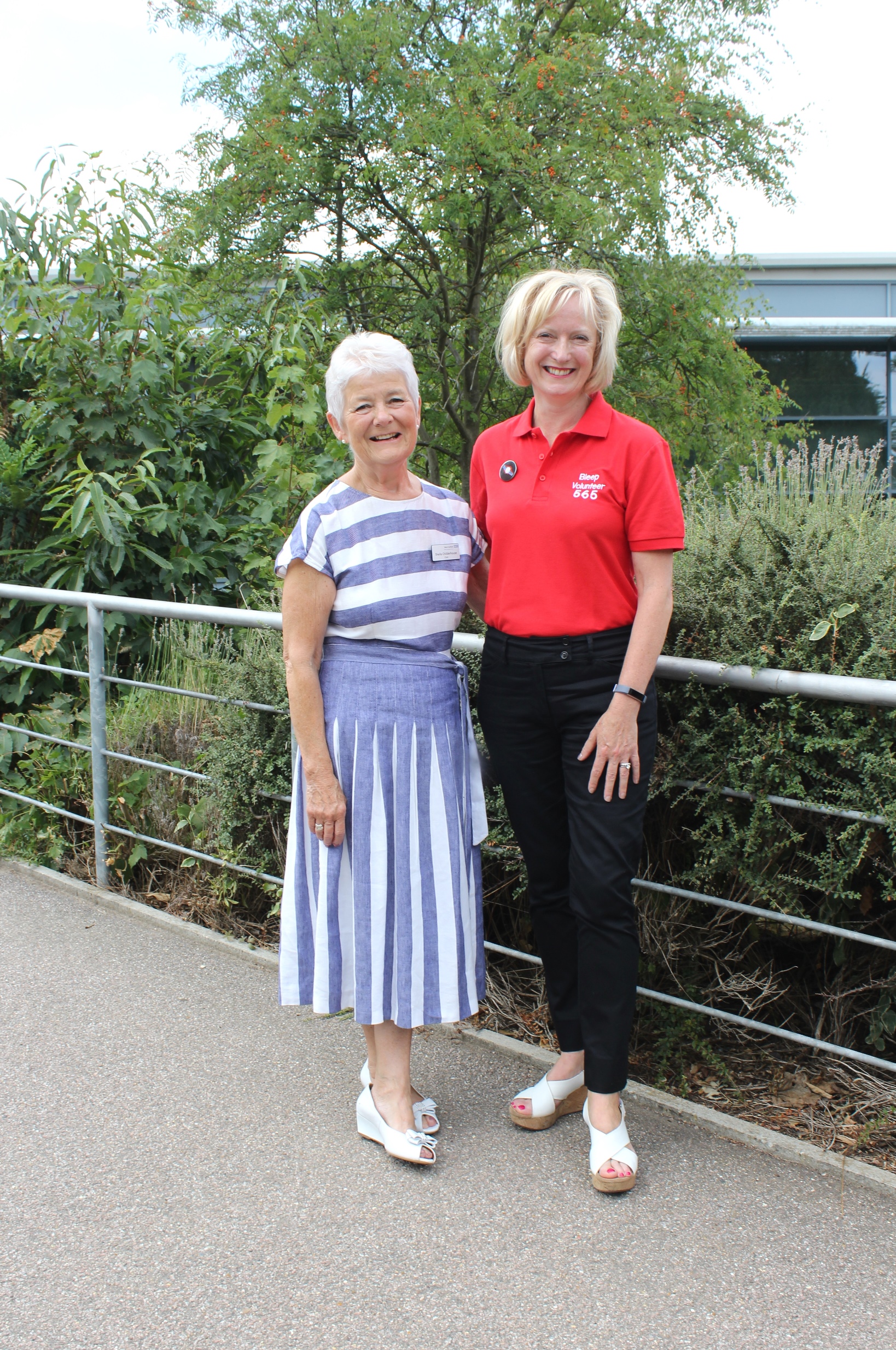 Ruth May, executive director of nursing at NHS Improvement (right), wearing a West Suffolk NHS Foundation Trust ‘bleep’ volunteer uniform with Sheila Childerhouse, Trust chair
