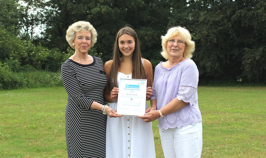 Rosie Gault (centre) receiving the Dr Damian Kershaw Award from Jackie Kershaw, left, and Angela Pearce, right, award sponsors