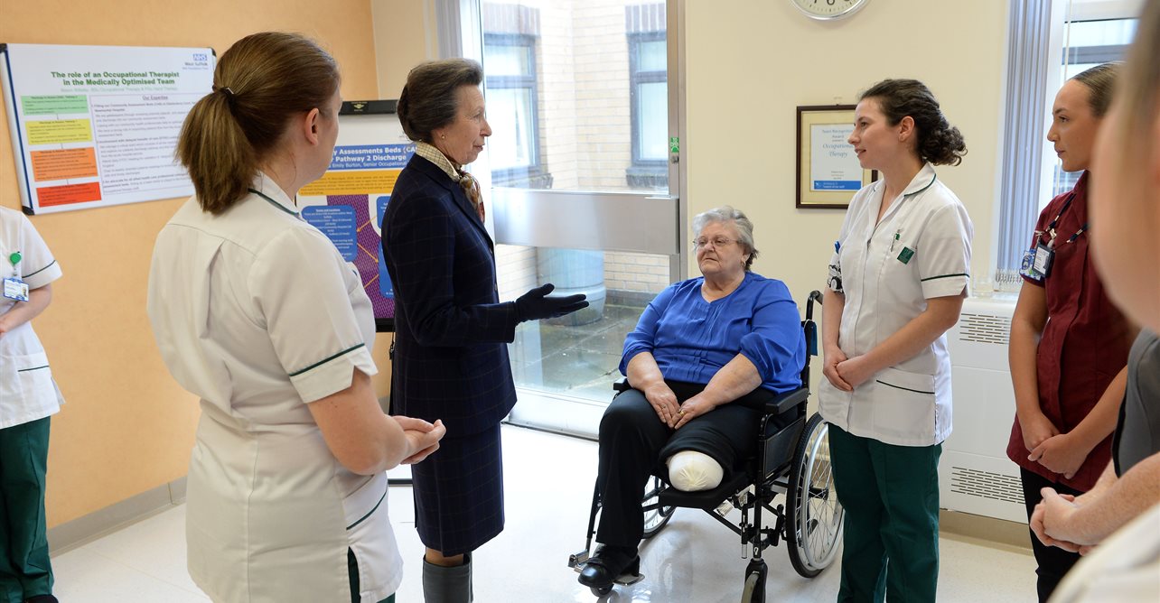 HRH The Princess Royal, speaks to occupational therapists and patient during her visit. 