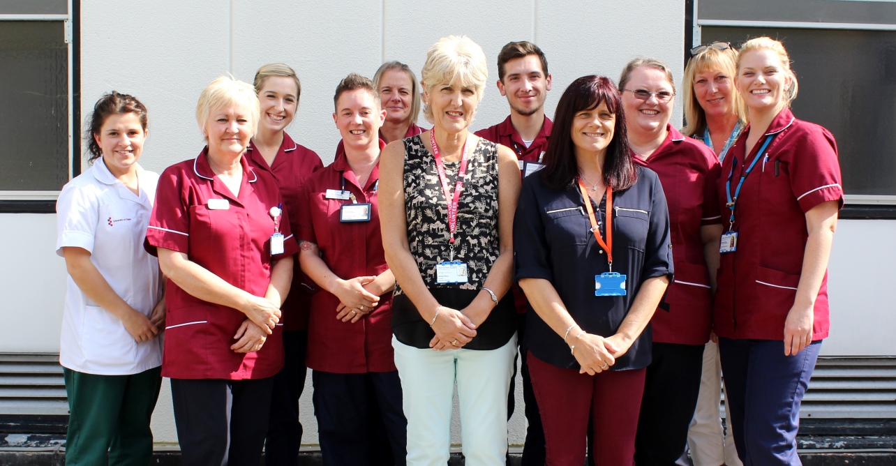 Jacqui Ricot, volunteer transport companion (centre) with the early intervention team