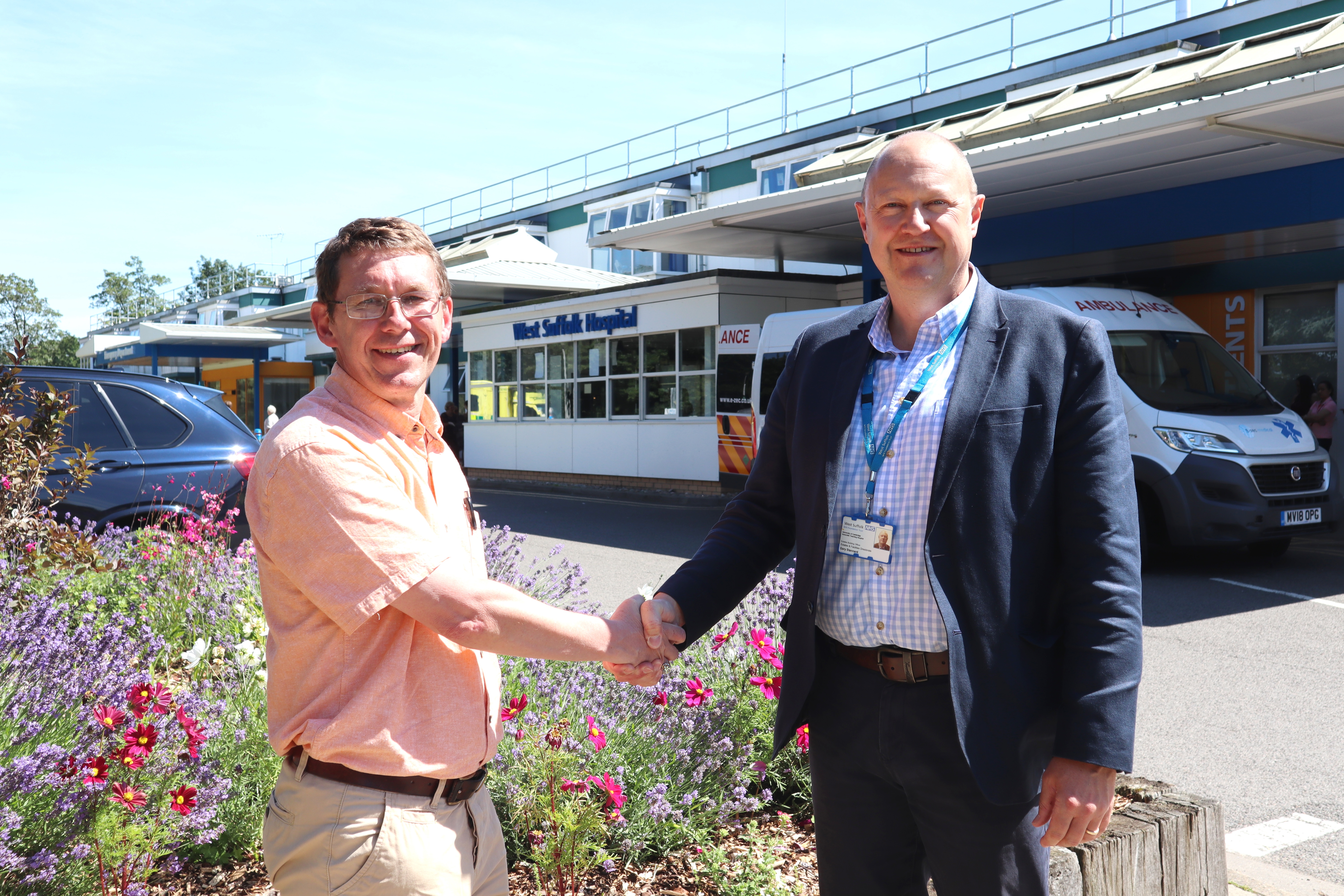 Stephen Bloom, Bury in Bloom co-ordinator, and Gary Stannard, estates operations maintenance manager outside the West Suffolk Hospital