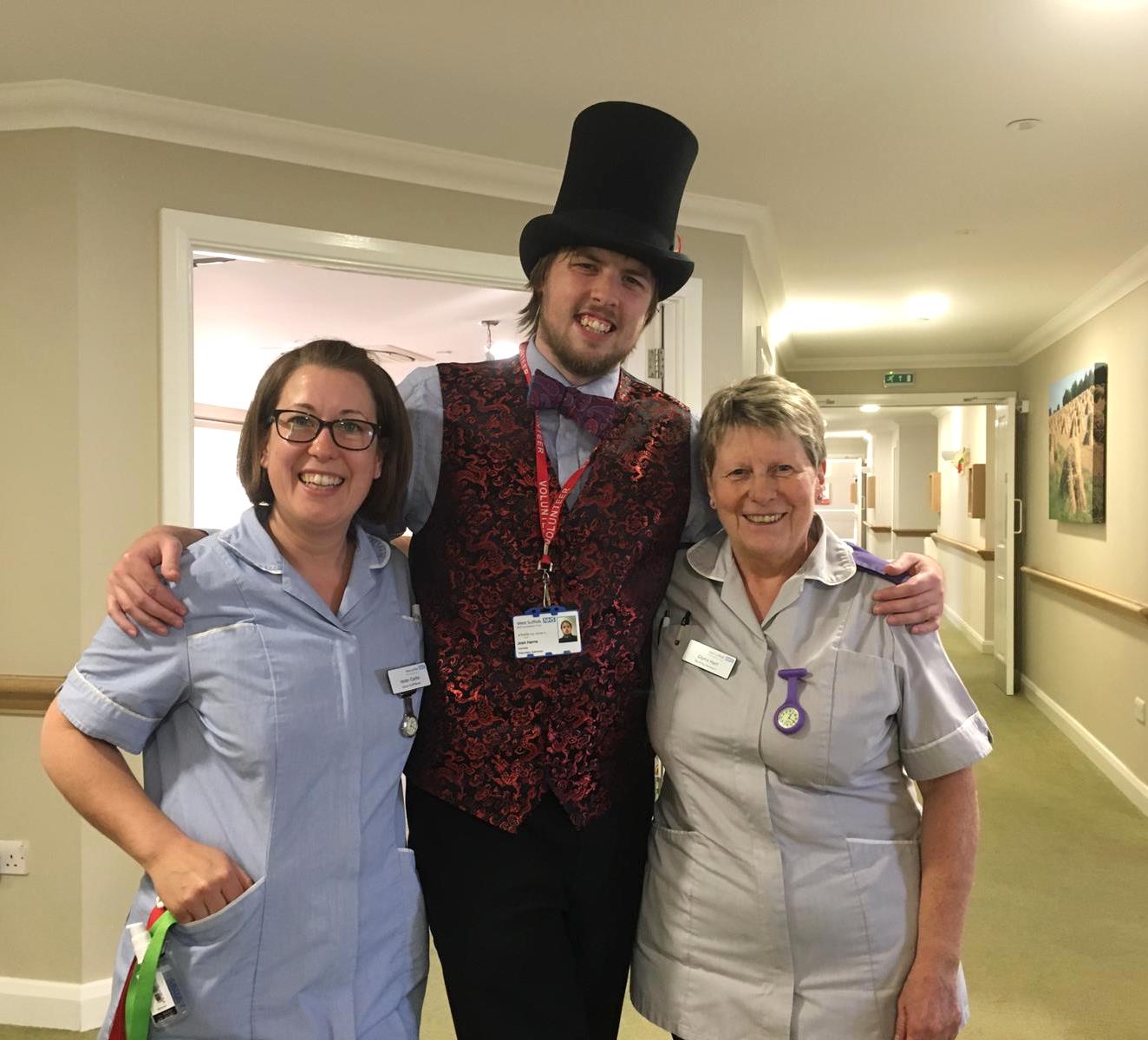 L-R Helen Clarke, senior staff nurse, storyteller volunteer Joshua Harris, and Glynis Hart, nursing assistant at the WSFT King Suite wing of Glastonbury Court care home