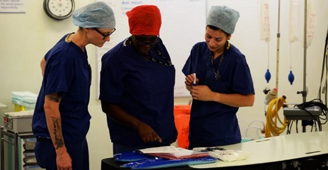 Tech. Sgt. Amy Templeton (left), non-commissioned officer in charge of the operating room for the 48th Surgical Operations Squadron, with colleagues at the West Suffolk Hospital