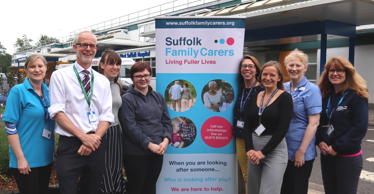 Trust staff and Suffolk Family Carers celebrating the launch of the young adult carer's ID card