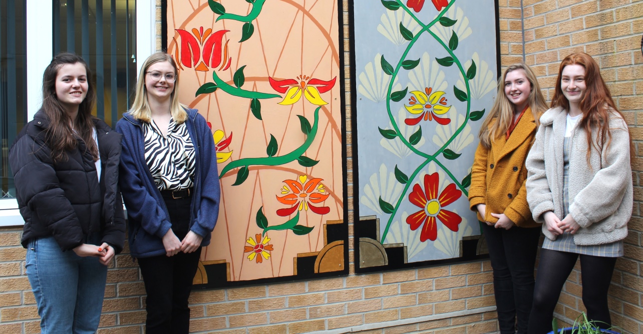 (Left to right) Meredith Halls, 17, Ruth Burgess, 17, Lottie Ellis, 17, Gabrielle Murphy, 18, students from King Edward VI School, Bury St Edmunds, in front of the mural they have created for West Suffolk NHS Foundation Trust.