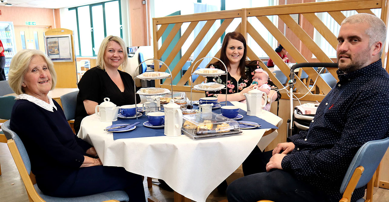 Baby Daisy enjoys afternoon tea at West Suffolk Hospital with her family