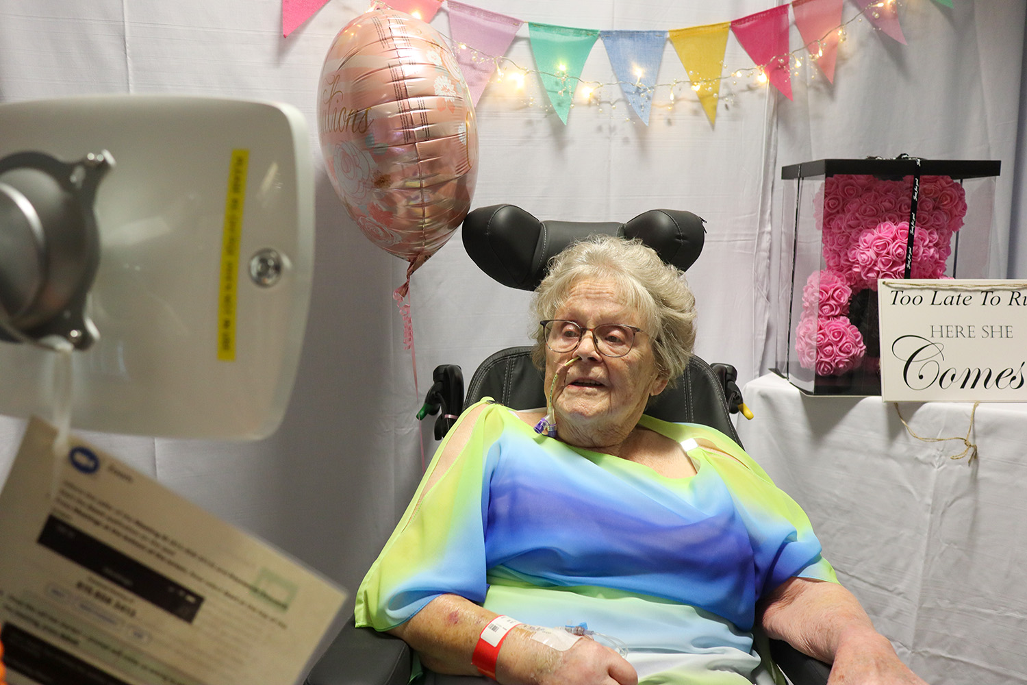 Doris watches her daughter Mel get married by video link