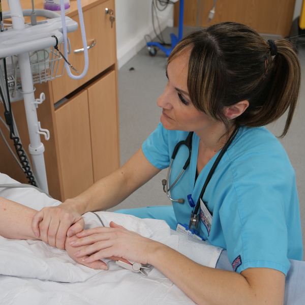 Critical care outreach nurse Tina Clemens with a patient